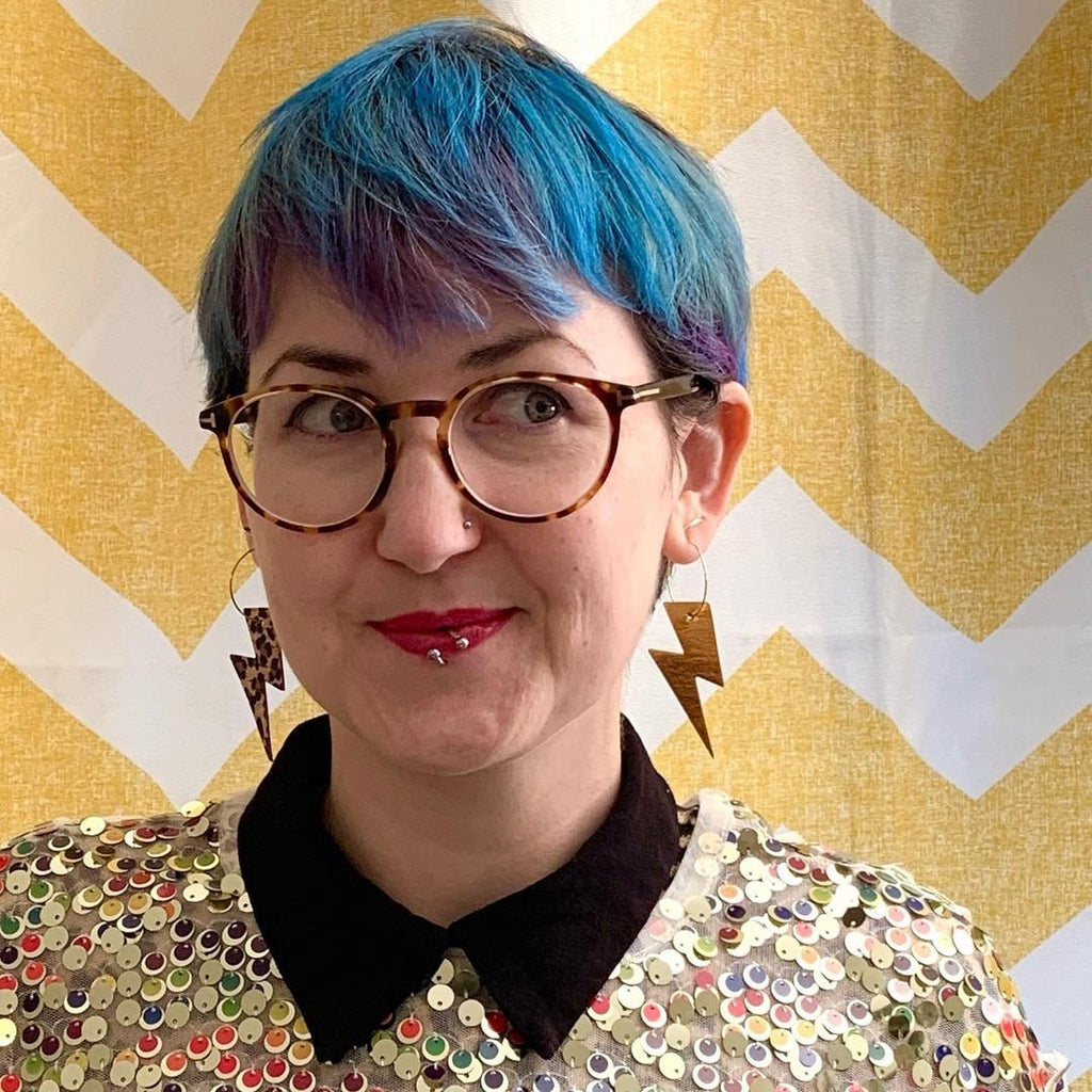Gold and leopard lightning bolt earrings