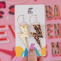 Gold and leopard lightning bolt earrings