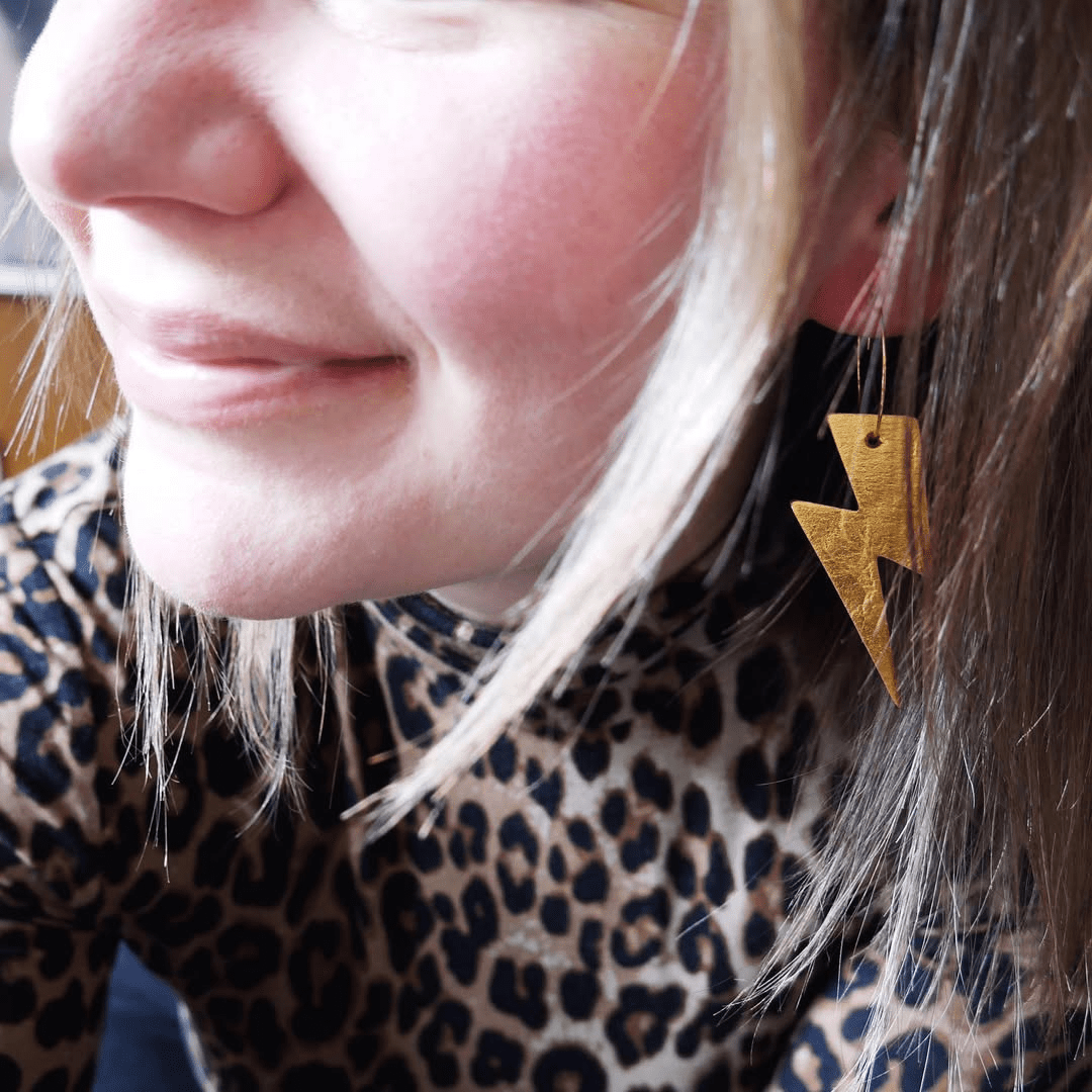 Gold and leopard lightning bolt earrings